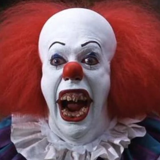 Tim Curry som Pennywise. 