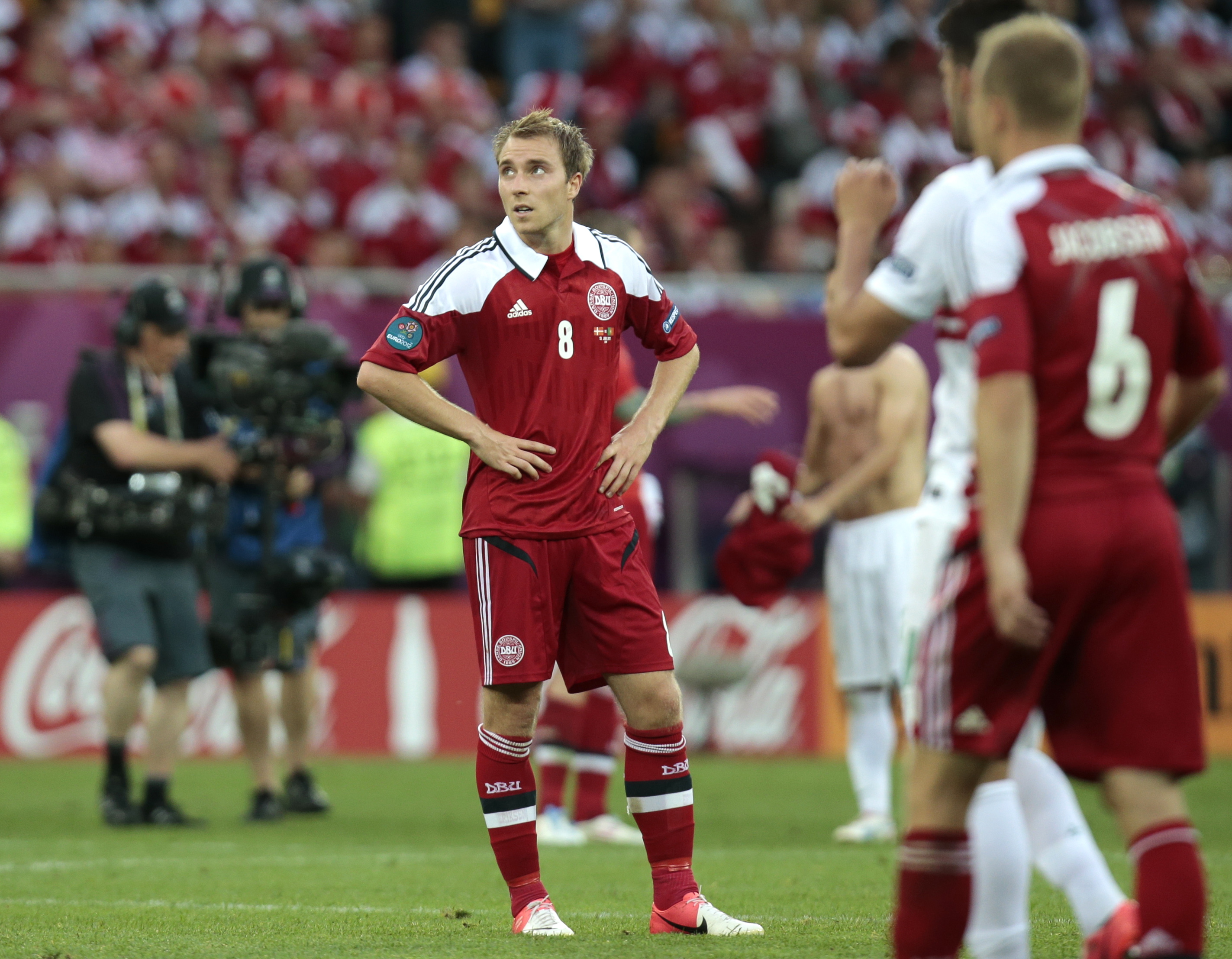 Danmarks Christian Eriksen deppar efter förlusten mot Portugal.