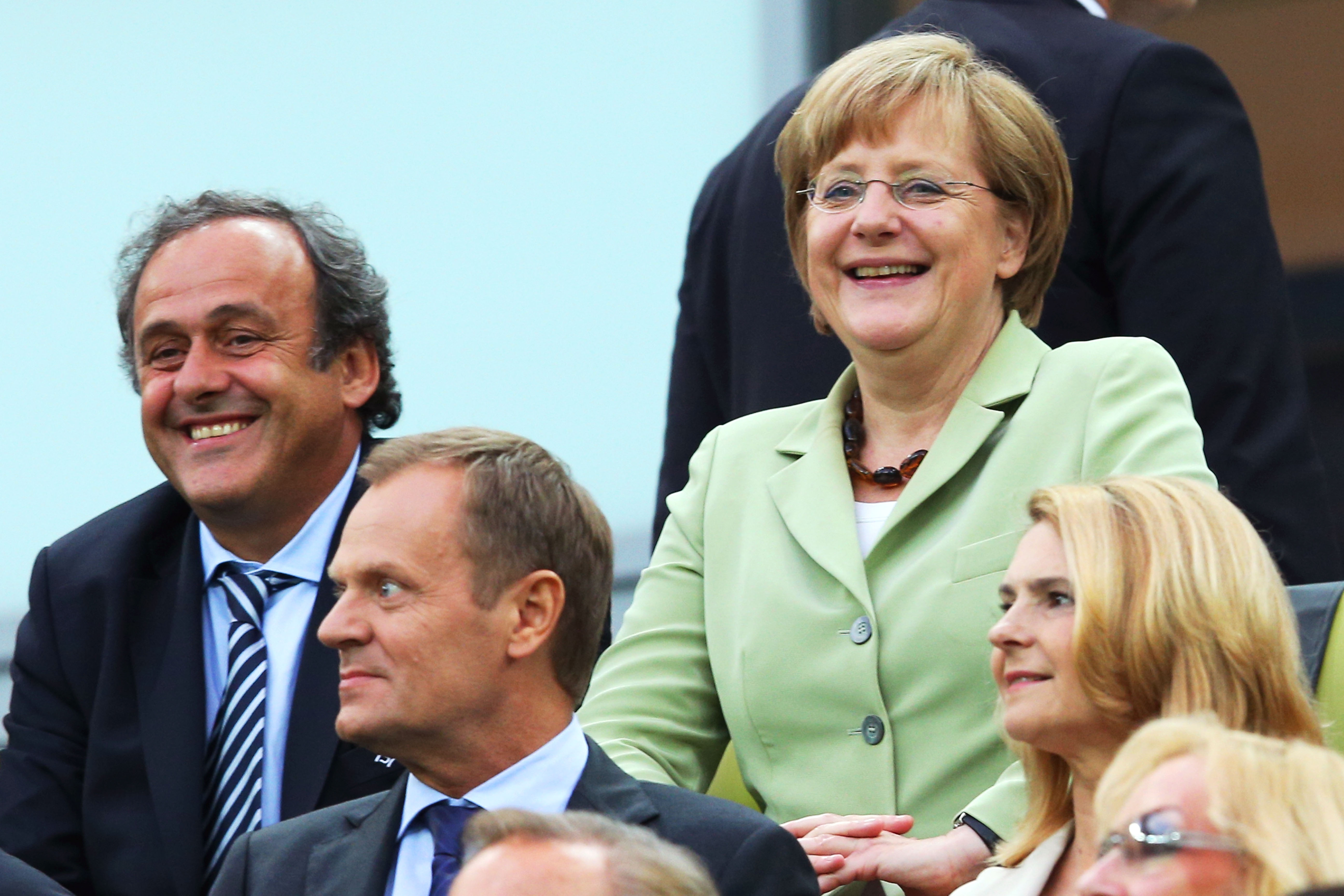 Tysklands förbundskansler trivdes med Uefas president Michel Platini.