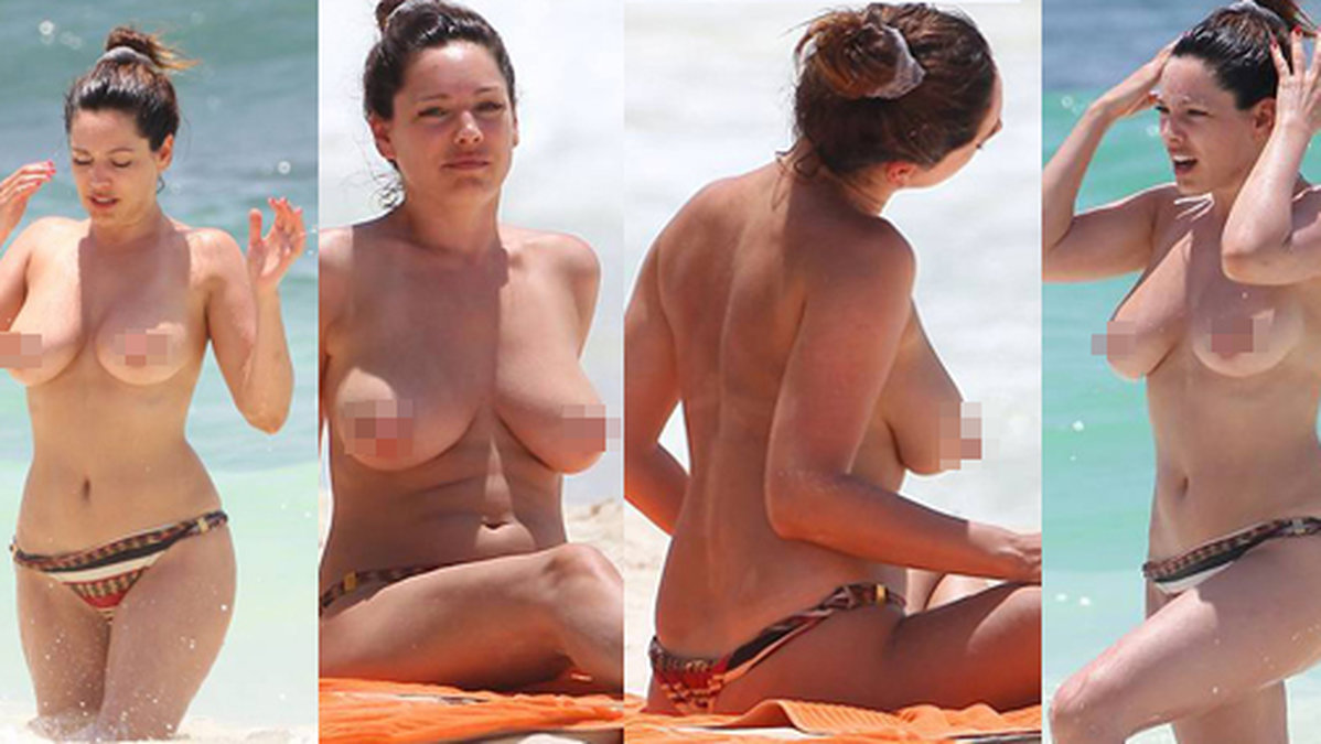 Den brittiska modellen Kelly Brook kastade bikiniöverdelen och njöt av solens strålar. OBS: Varning för ocensurerade bilder i bildspelet!